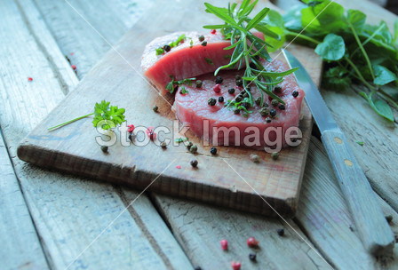 Fresh beef meat with rosemary branch and pep