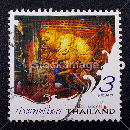 A stamp printed in Thailand shows Thai carving