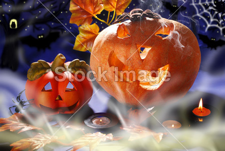 Halloween still life with pumpkins glowing in the
