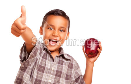 西班牙裔男孩与苹果和拇指向上图片素材(图片