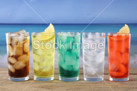 Cola and lemonade soda drinks on the beach图