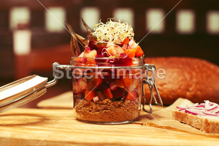 Mason jar with pieces of vegetables (carrot, on