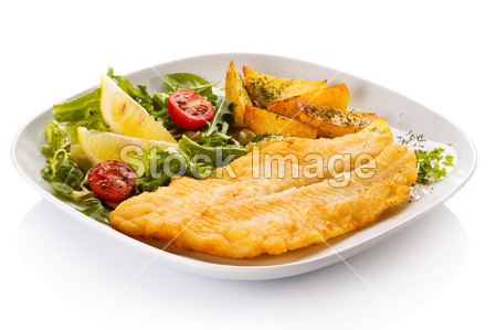 Fish dish - fried fish fillet with baked potatoes a