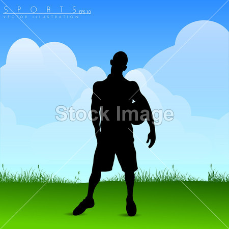 年轻的足球运动员在手拿足球球的侧面影像图片