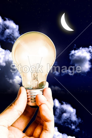 Warm lamp bulb in the hand shine the light with