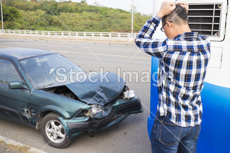 Stressed Driver looking the car After Traffic Ac